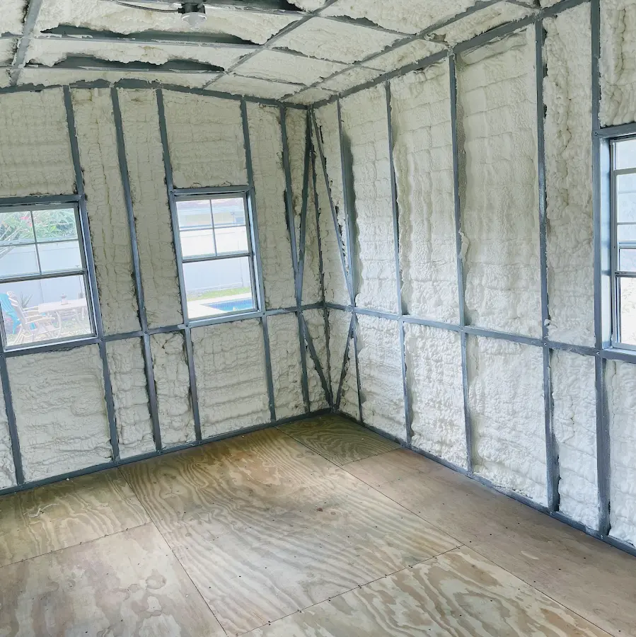 Closed-cell spray foam insulation applied to wall cavities in a residential project in Barberton